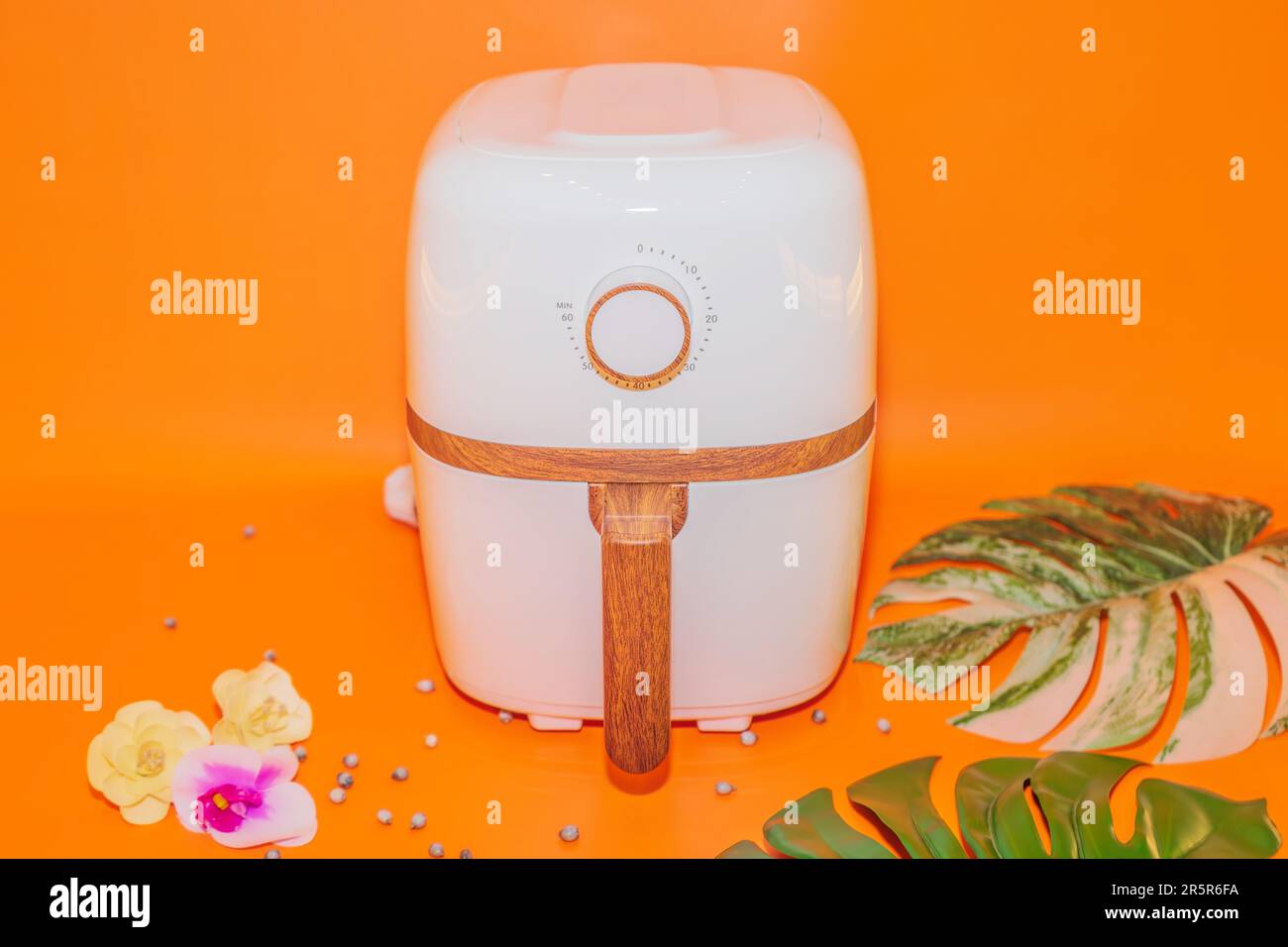 The White Air Fryer with Wooden Handle Design combines functionality