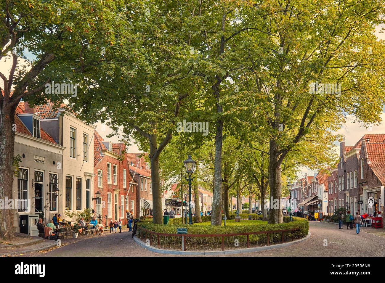 Veere, The Netherlands - October 11, 2022: The central historic street with shops, bars and restaurants in the ancient Dutch city center of Veere in Z Stock Photo