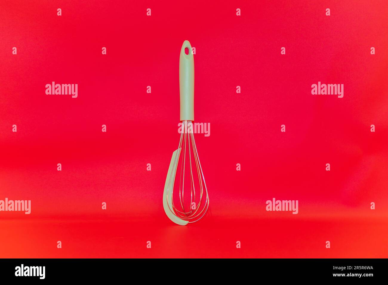 The GreenHandled Manual Egg Beater is a versatile kitchen tool that