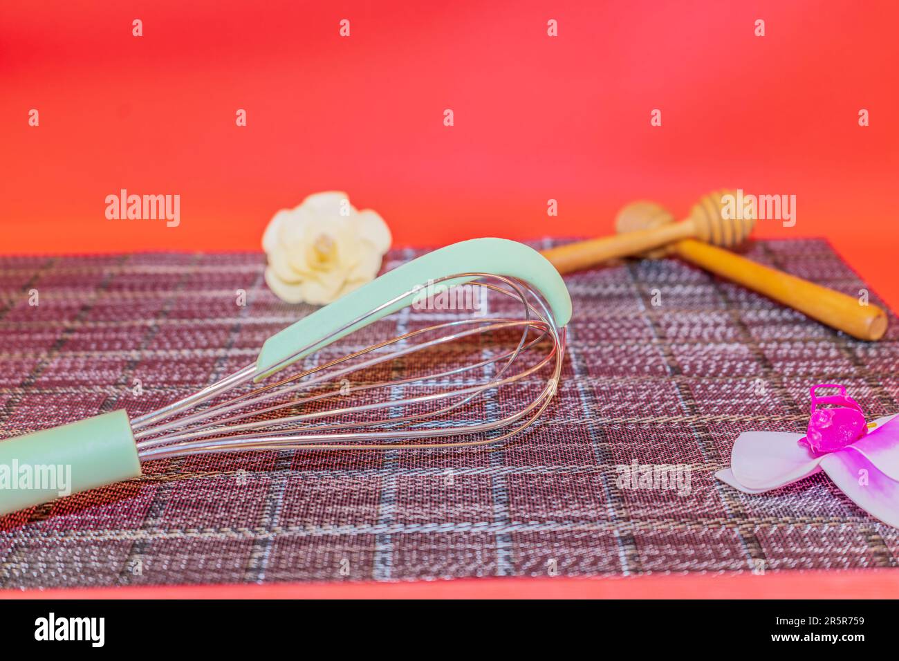 The GreenHandled Manual Egg Beater is a versatile kitchen tool that