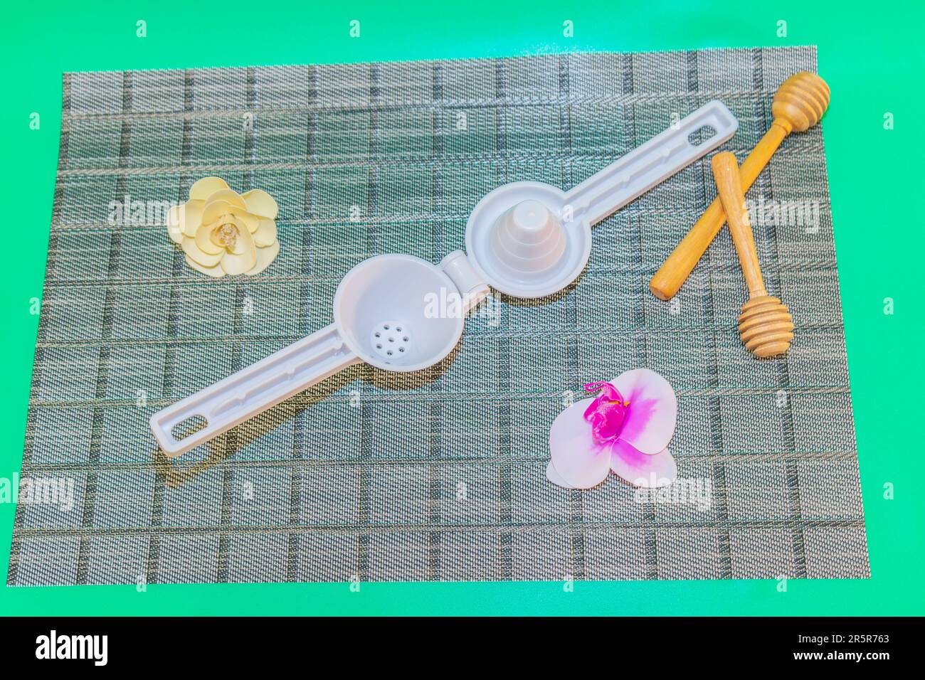 The White Citrus Juicer is a convenient and efficient tool for extracting fresh juice from citrus fruits. Stock Photo