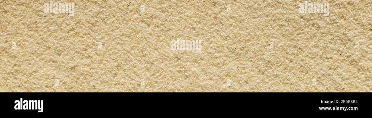 Banner horizontal sandy light smooth background format 4:1 sand macro photography Stock Photo