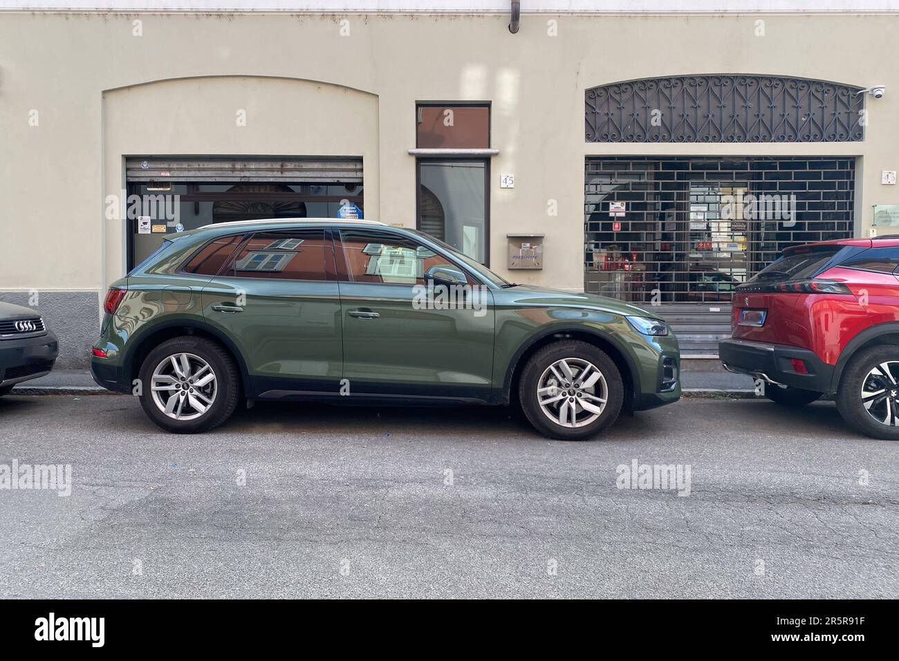 Cremona, Italy - May 2023 District Green Audi Q5 parked in the street. Stock Photo