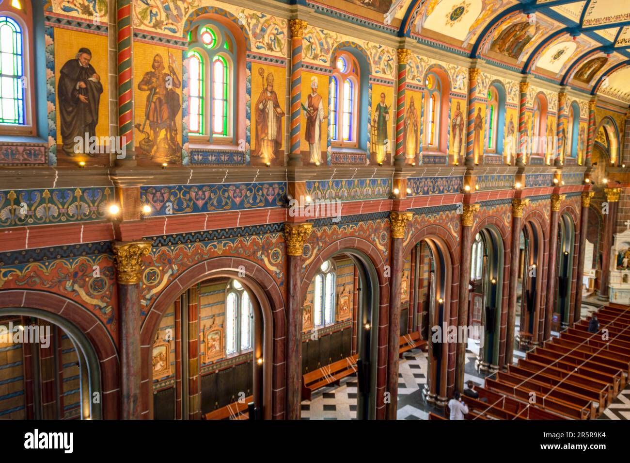 An image of a grand cathedral featuring a high-vaulted ceiling and
