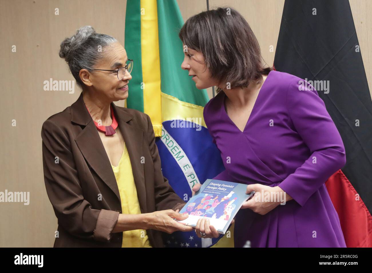 Brazilian Environment Minister Marina Silva, left, receives a book from Germany's Foreign Minister Annalena Baerbock during their meeting for talks on bilateral relations, trade and the environment in Brasilia, Brazil, Monday, June 5, 2023. (AP Photo/Gustavo Moreno) Stock Photo