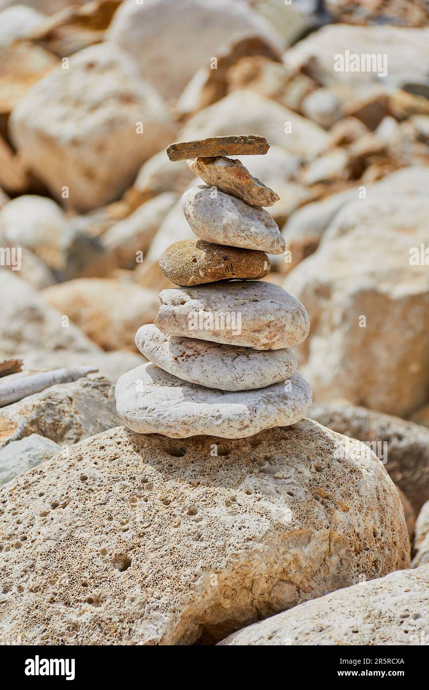 made of stone tower on the beach and blur background Stock Photo - Alamy