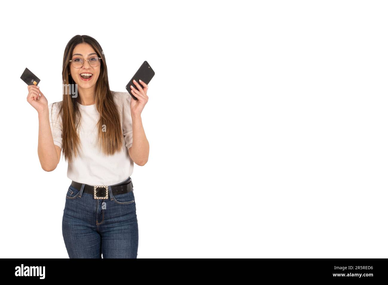 cheerful caucasian woman mobile shopping. Buying online. Holding credit card and smartphone. Making payment. Internet banking. E-commerce concept idea Stock Photo
