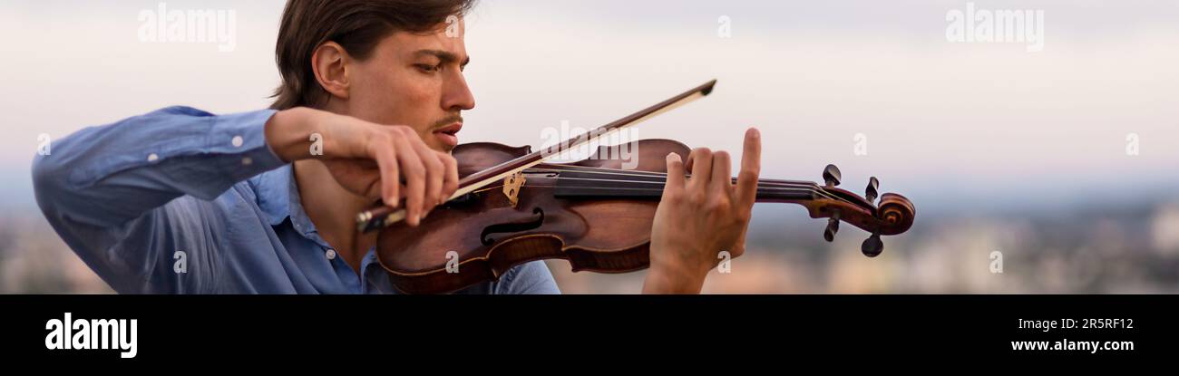 Linkedin banner with an inspired musician playing the violin Stock Photo