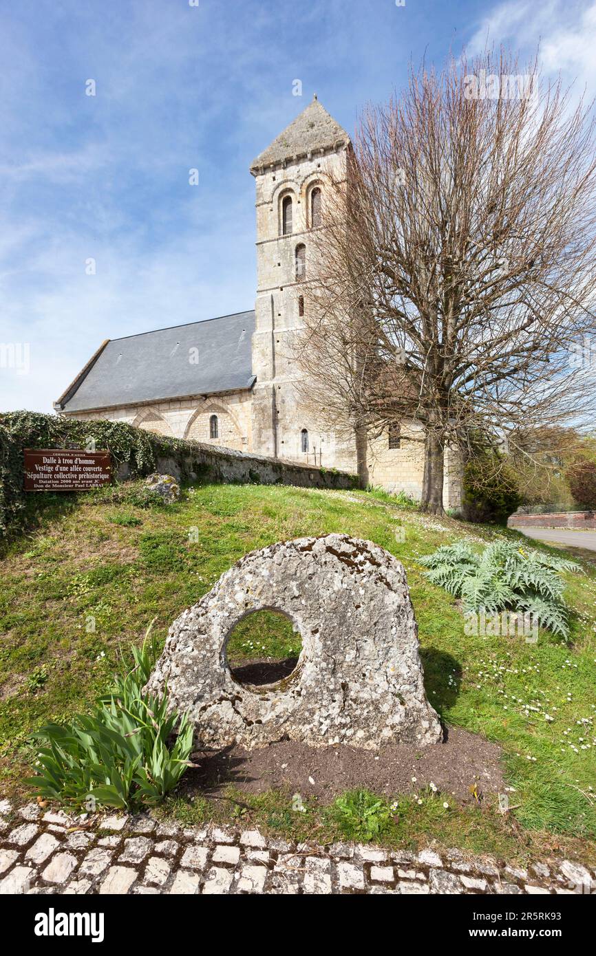 France, Eure, Aizier, Route des Chaumières loop, Saint-Pierre church and Pierced stone, also Manhole slab, monument dating from the Neolithic era, part of a collective burial site in the form of a gallery grave Stock Photo