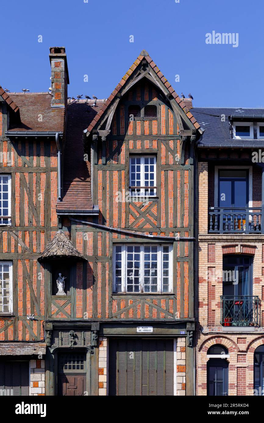 France, Eure, Risle Valley, Pont-Audemer, labeled the Most Beautiful Detours of France, nicknamed the Little Venice of Normandy, Place de Verdun, historic half-timbered building, with wooden sculptures on a beam Stock Photo