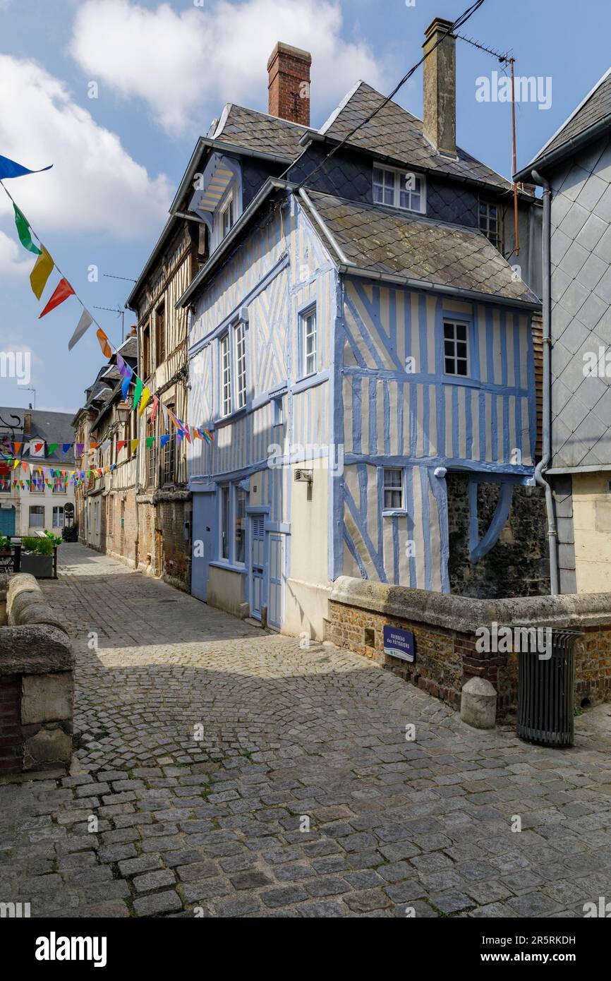 France, Eure, Risle Valley, Pont-Audemer, labeled the Most Beautiful Detours of France, nicknamed the Little Venice of Normandy, Rue Place de la Ville, medieval facade with blue half-timbering in a pedestrian street, small bridge spanning the Risle canal, named Ruisseau des Pâtissiers Stock Photo