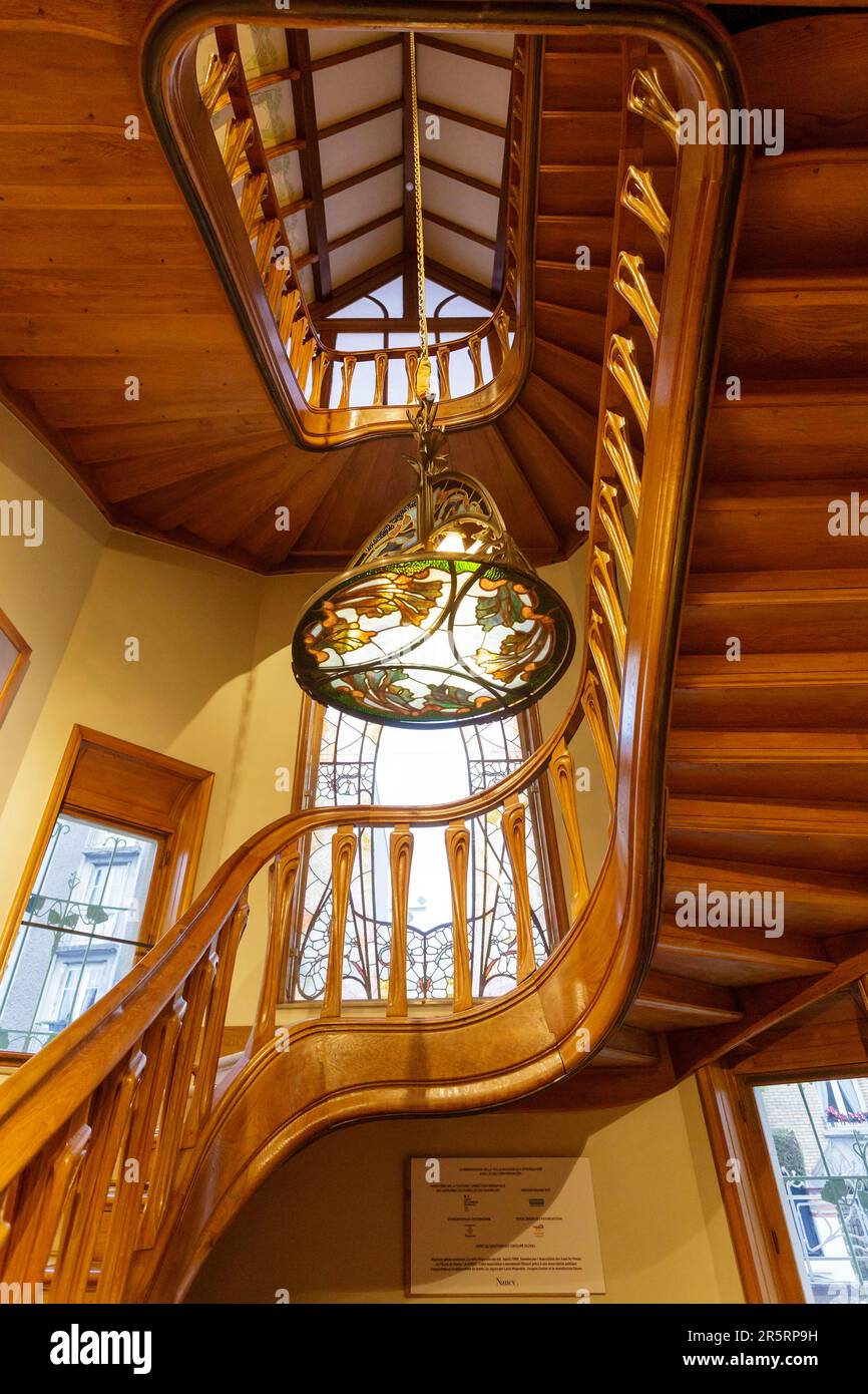 France, Meurthe et Moselle, Nancy, Villa Majorelle also named Villa Jika listed as Maison des Illustres by architect Henri Sauvage in Art Nouveau Ecole de Nancy (Nancy school) style, the railing by Henri Sauvage made in Louis majorelle workshop in the staircase, the chandelier with a decoration of sea weeds by Louis Majorelle and the stained glass windows by master glassmaker Jacques Gruber located Rue Louis Majorelle Stock Photo