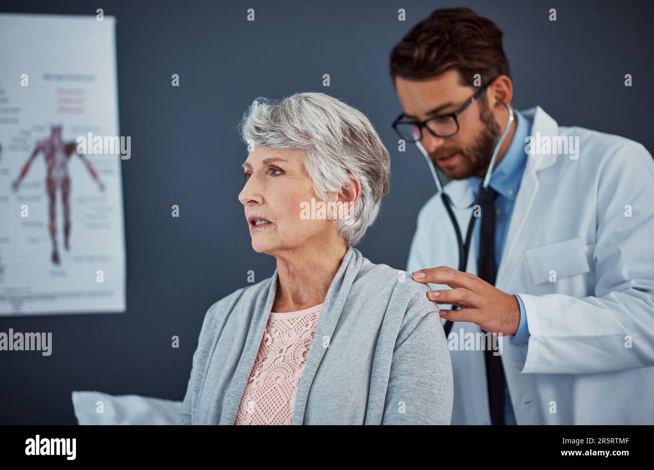 Time for her routine checkup. a doctor examining a senior patient with ...