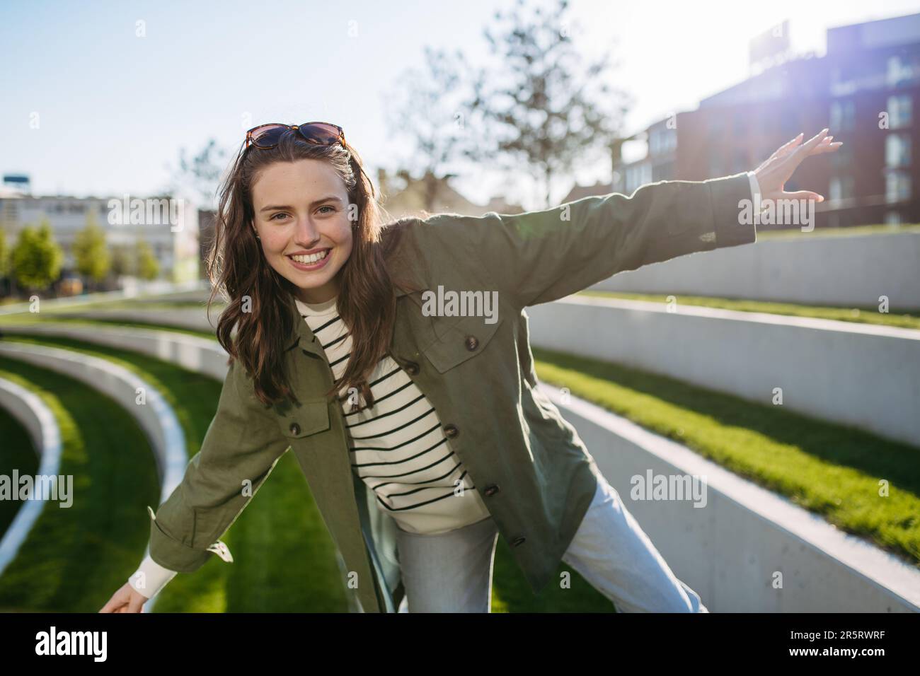 Young woman spending her free time in city park. Stock Photo