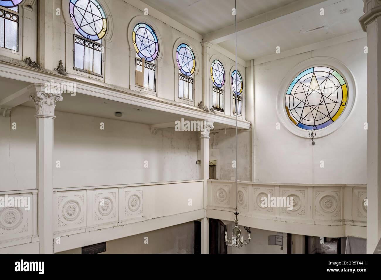 France, Seine-Maritime, Elbeuf-sur-Seine, designated as French Towns and Lands of Art and History, interior of the synagogue, women's gallery and details of the multicolored stained glass windows bearing the seal of Solomon, inaugurated in 1909, closed since 1995, selected for the Heritage Lotto in March 2023 Stock Photo