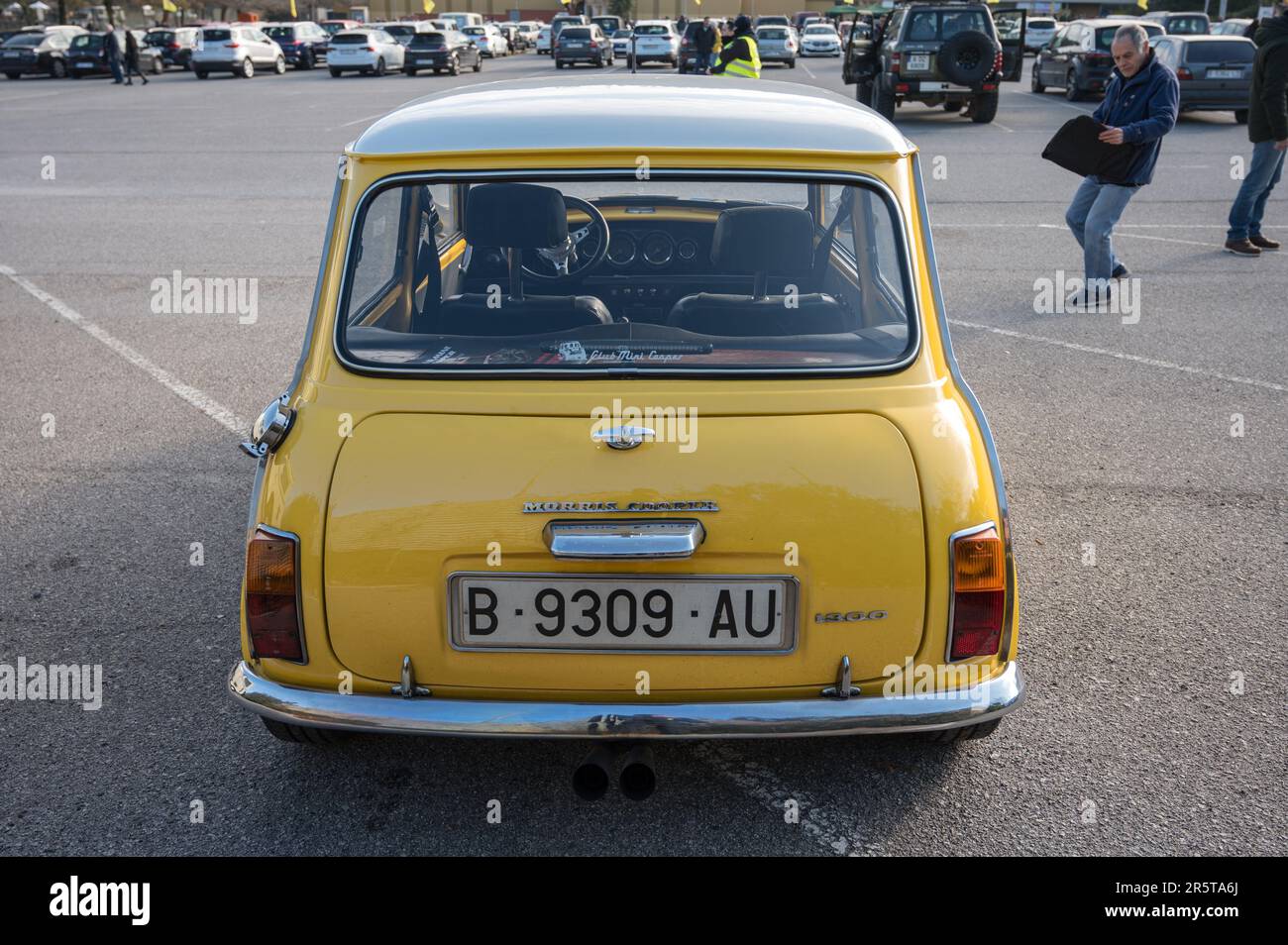 Rear view of a classic yellow Morris Mini Cooper S 1300 with a white roof Stock Photo