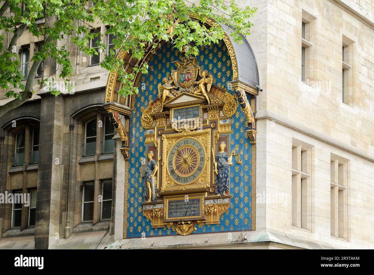 The medieval Clock Tower of the Palais de la Cité (Tour-de-l'Horloge) - detail of the first public clock in Paris (1370) - France Stock Photo