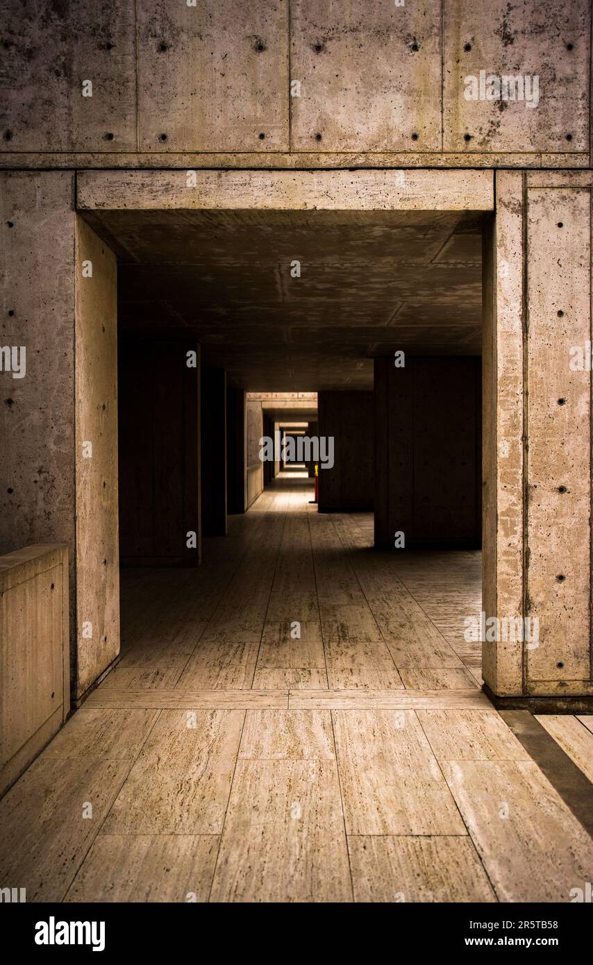 An interior view of an underground building, featuring a door set ...