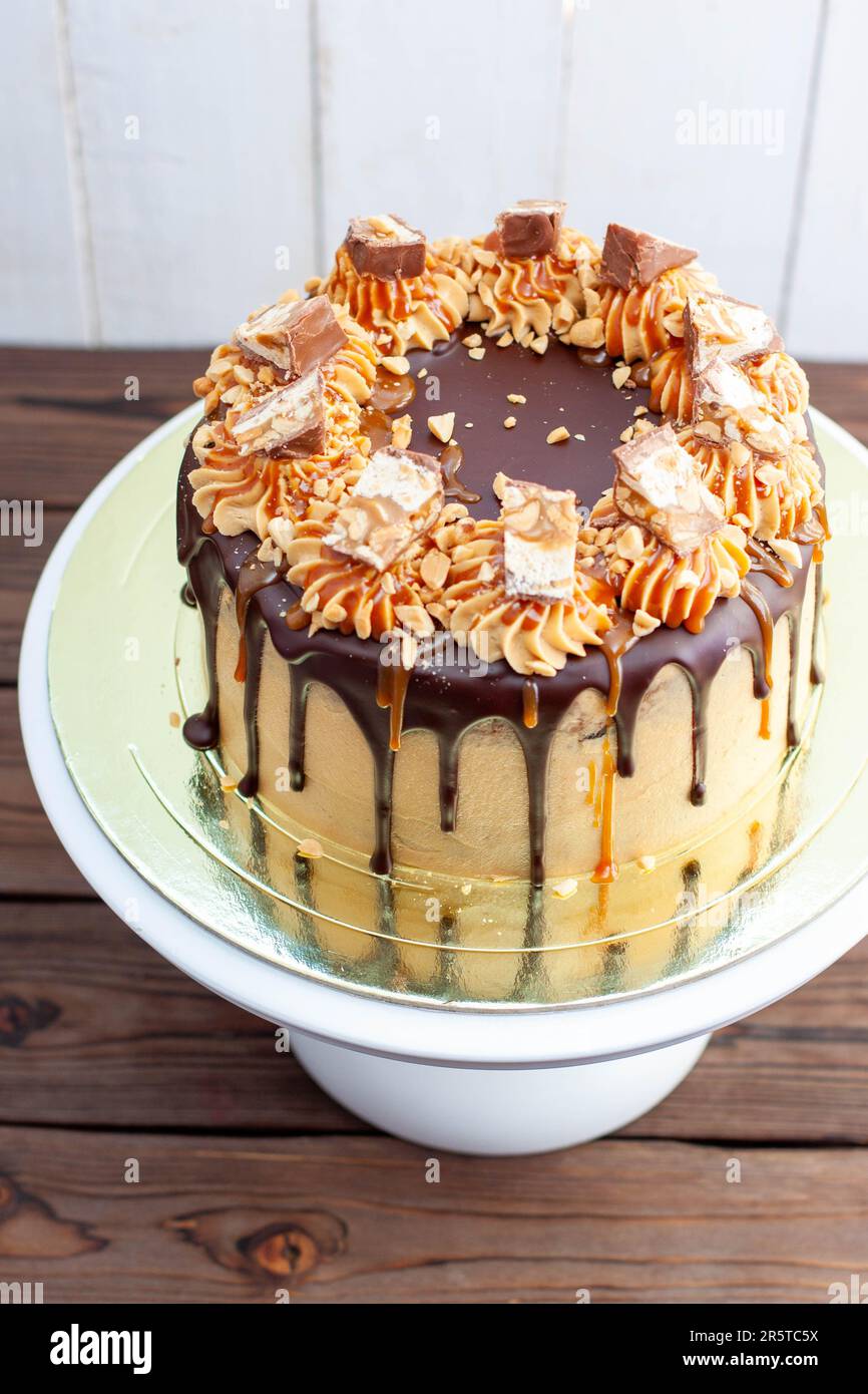 Gorgeous snickers cake with peanut butter cream, melted chocolate ...