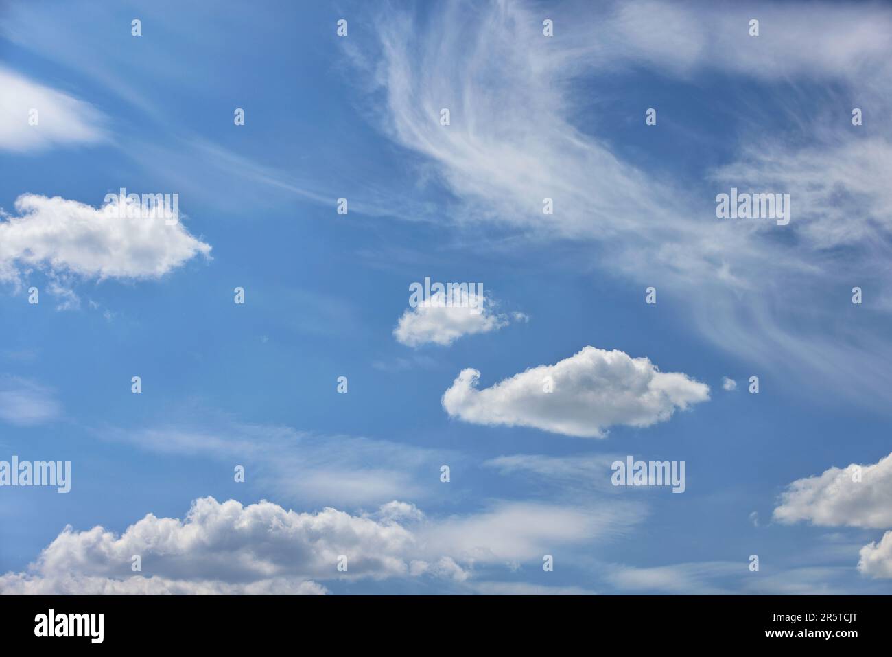 Blue sky background with white clouds, floating on blue sky. Stock Photo