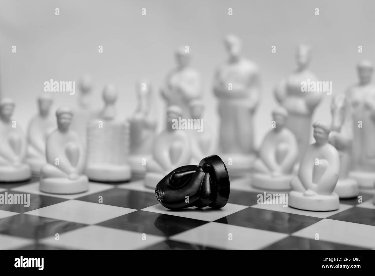 Ukrainian chess with Gogol's heroes on the board symbolizes battle and war Stock Photo