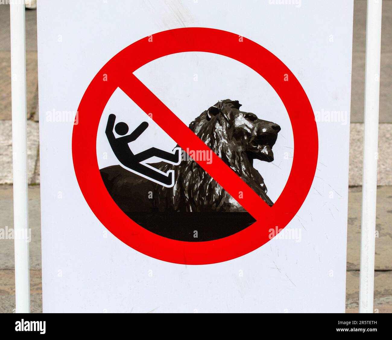 London, UK - April 30th 2023: A sign at Trafalgar Square in London, UK, warning visitors not to climb the Lion sculptures. Stock Photo