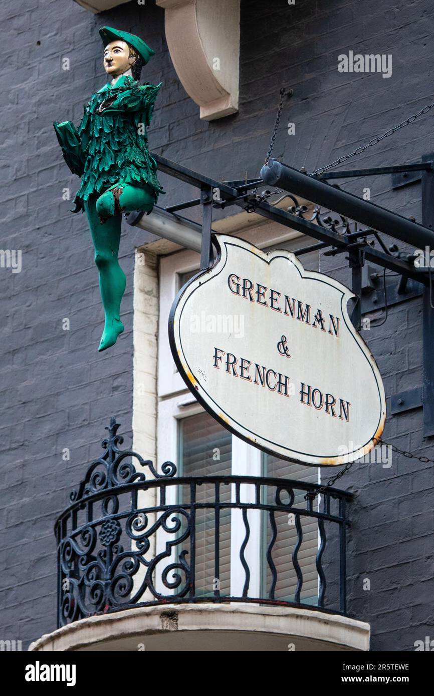 London, UK - April 30th 2023: Vintage sculpture and sign on the now closed public house called the Greenman and French Horn on St. Martins Lane in Lon Stock Photo