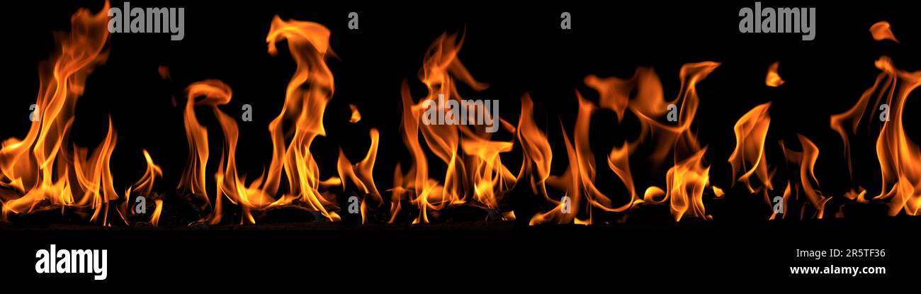 Banner 4x1 playing tongues and reflections of flame on a black background Stock Photo