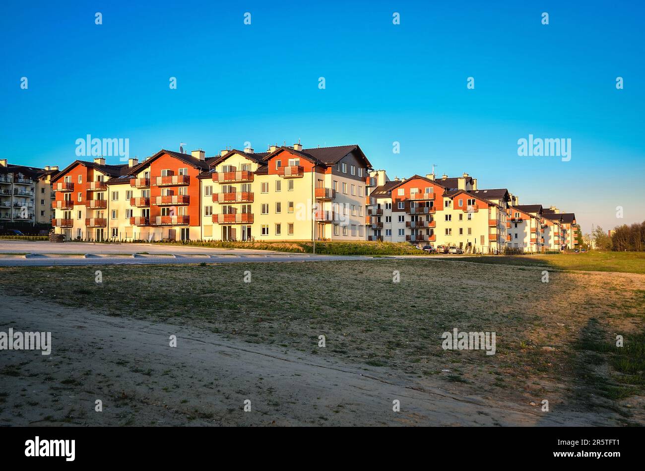 Tychy, Poland - April 29, 2016: New housing estates in Tychy City, Poland. Public view of newly built block of flats in the green area. Stock Photo