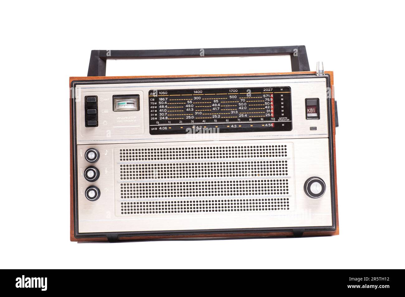 Old transistor radio isolated on white English translation: indicator settings, ranges, network (inscription in Russian). Stock Photo