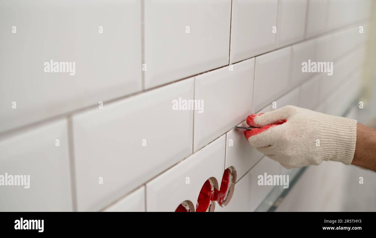 Cleaning seams after gluing ceramic tiles. Cleaning the seams of