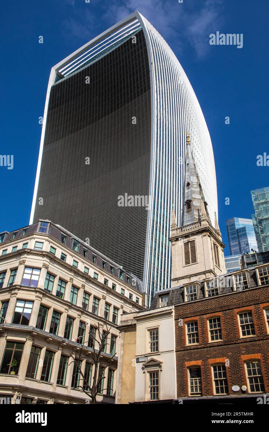 St. Margaret Pattens church, on Eastcheap in the City of London, UK. The skyscraper of 20 Fenchurch Street, also known as the Walkie Talkie is seen to Stock Photo