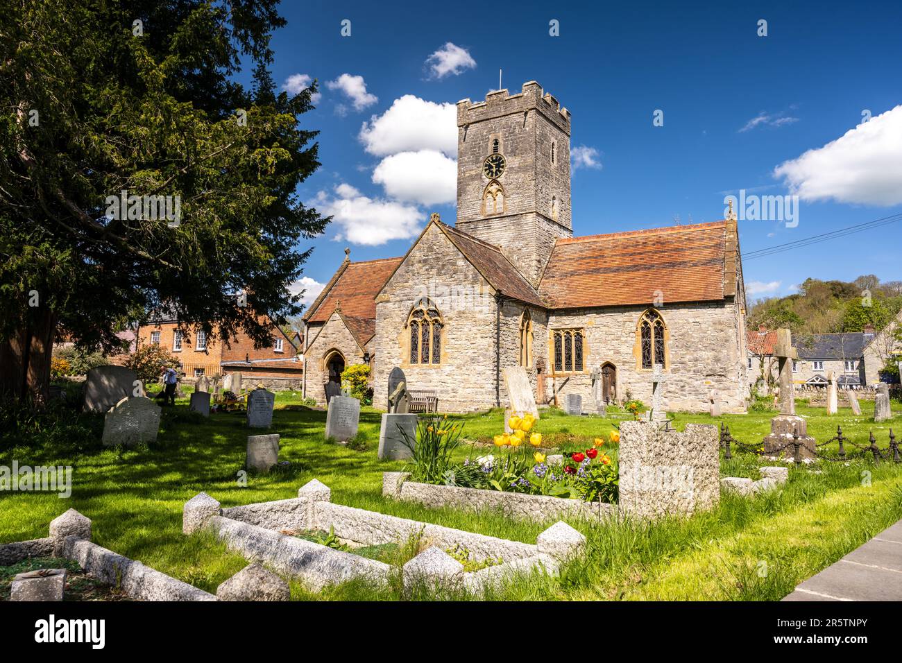 Sun shines on the traditional parish church of St Michael and All