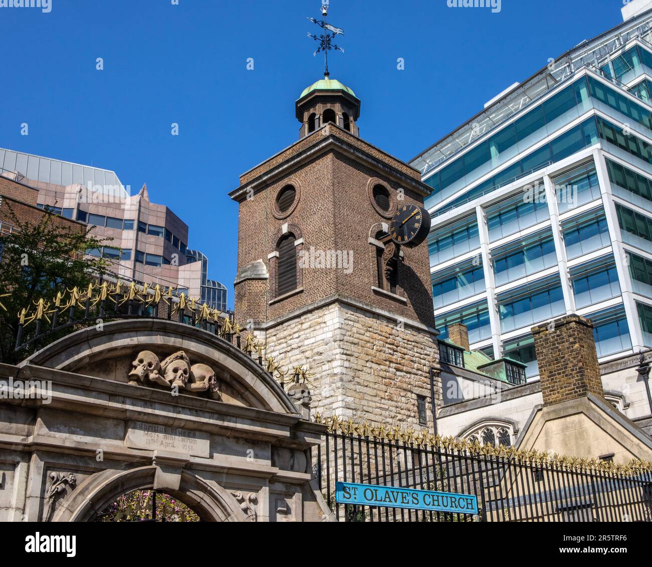 The tower and entrance gateway of the historic St. Olaves Church, located on Hart Street in the city of London, UK. Stock Photo