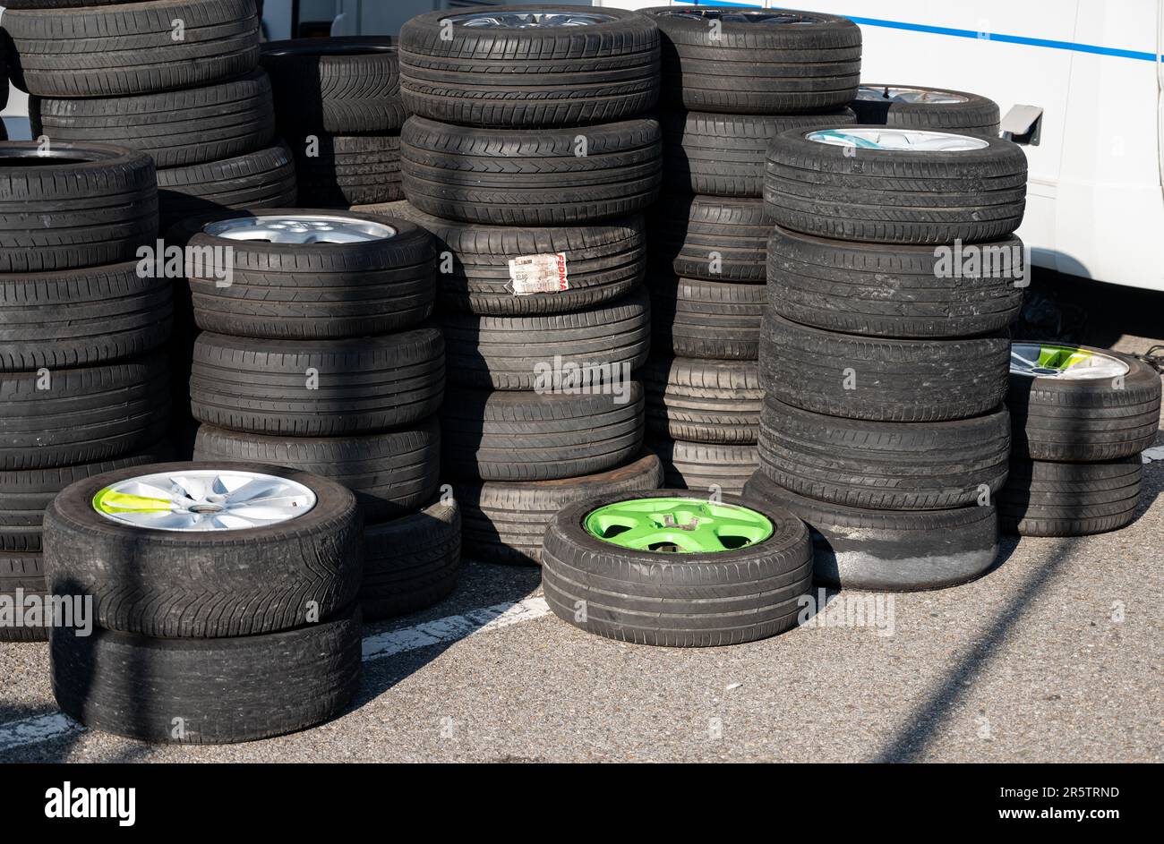 A pile of mounted wheels, tires and rims from a drift racing team Stock
