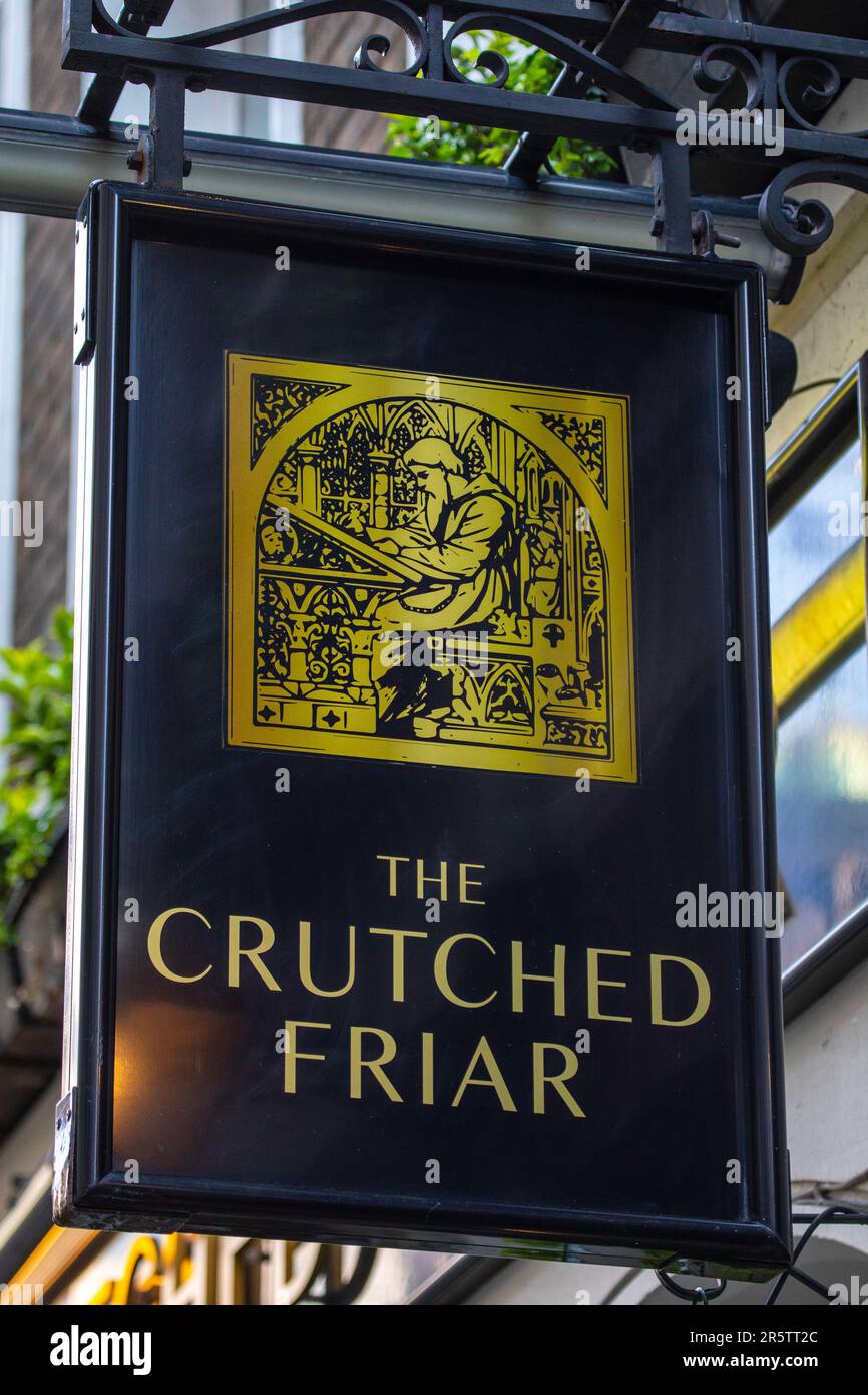 London, UK - April 17th 2023: The hanging signboard on the exterior of The Crutched Friar public house, located on Cructhed Friars in London, UK. Stock Photo