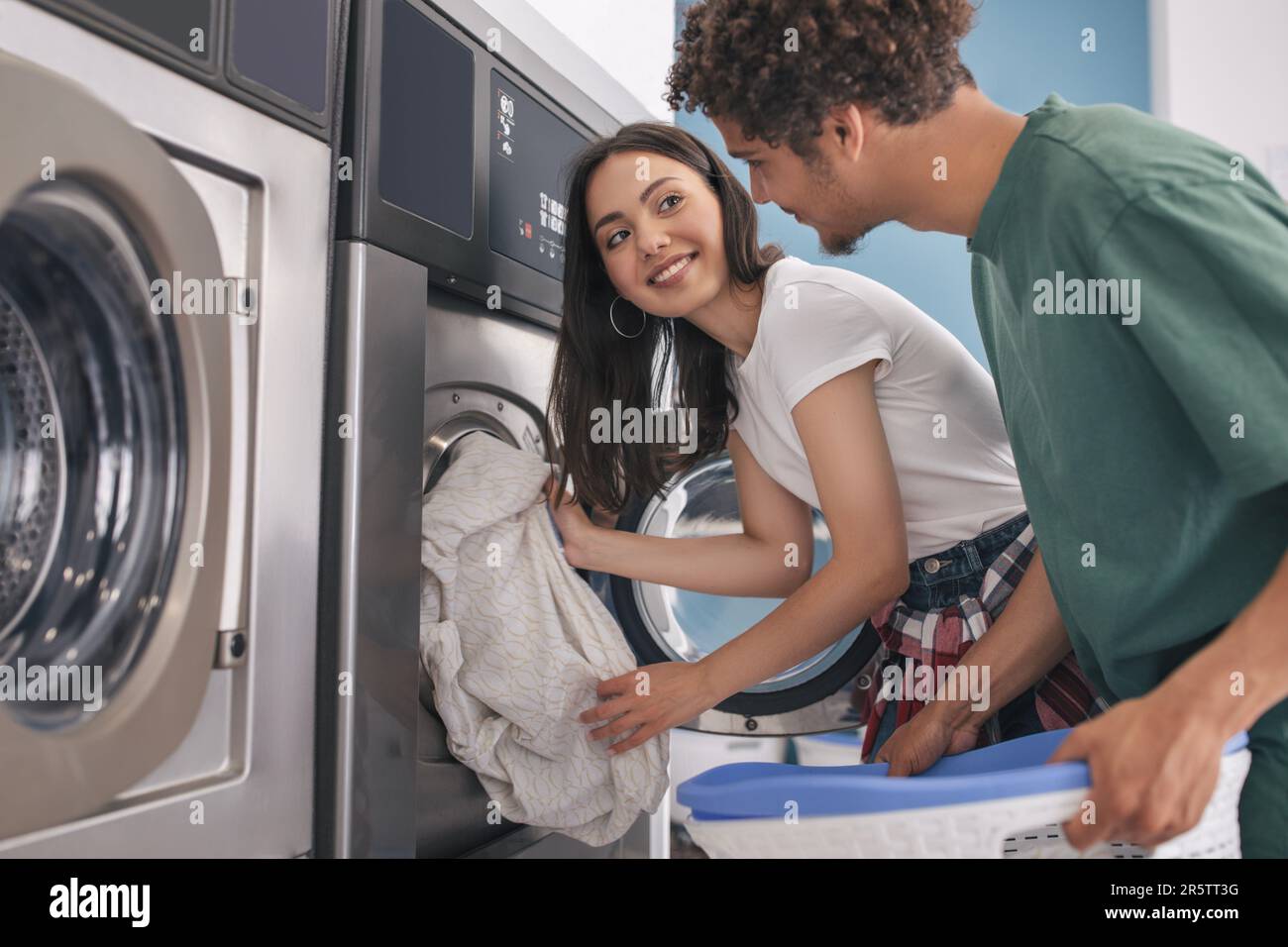 Beautiful Young Caucasian Lady Folds Underwear In The Laundromat Stock  Photo, Picture and Royalty Free Image. Image 10140225.