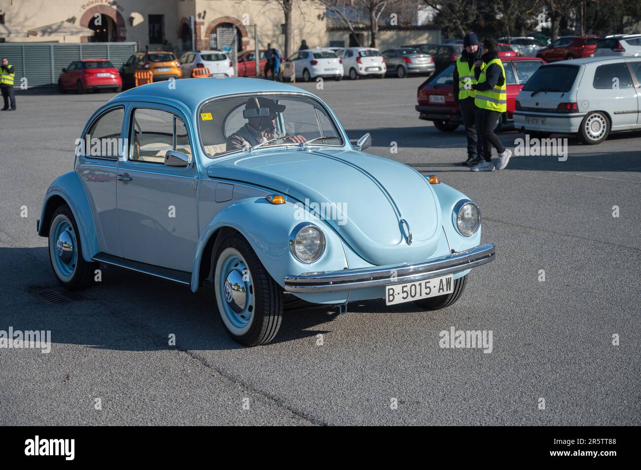 A classic sky blue Volkswagen type 1, driving on the street Stock Photo