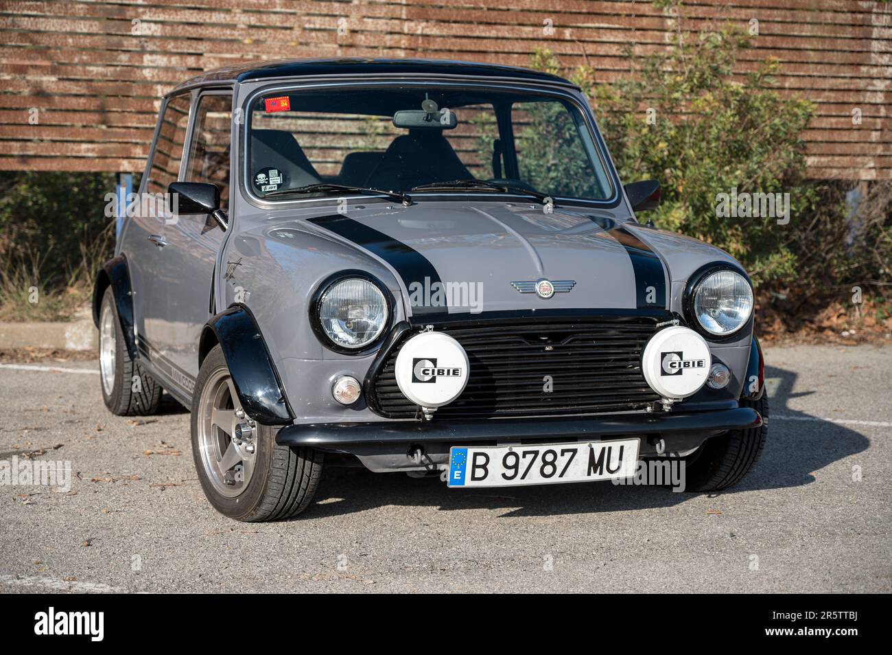 The front view of an old classic Mini Cooper in gray color on the street Stock Photo