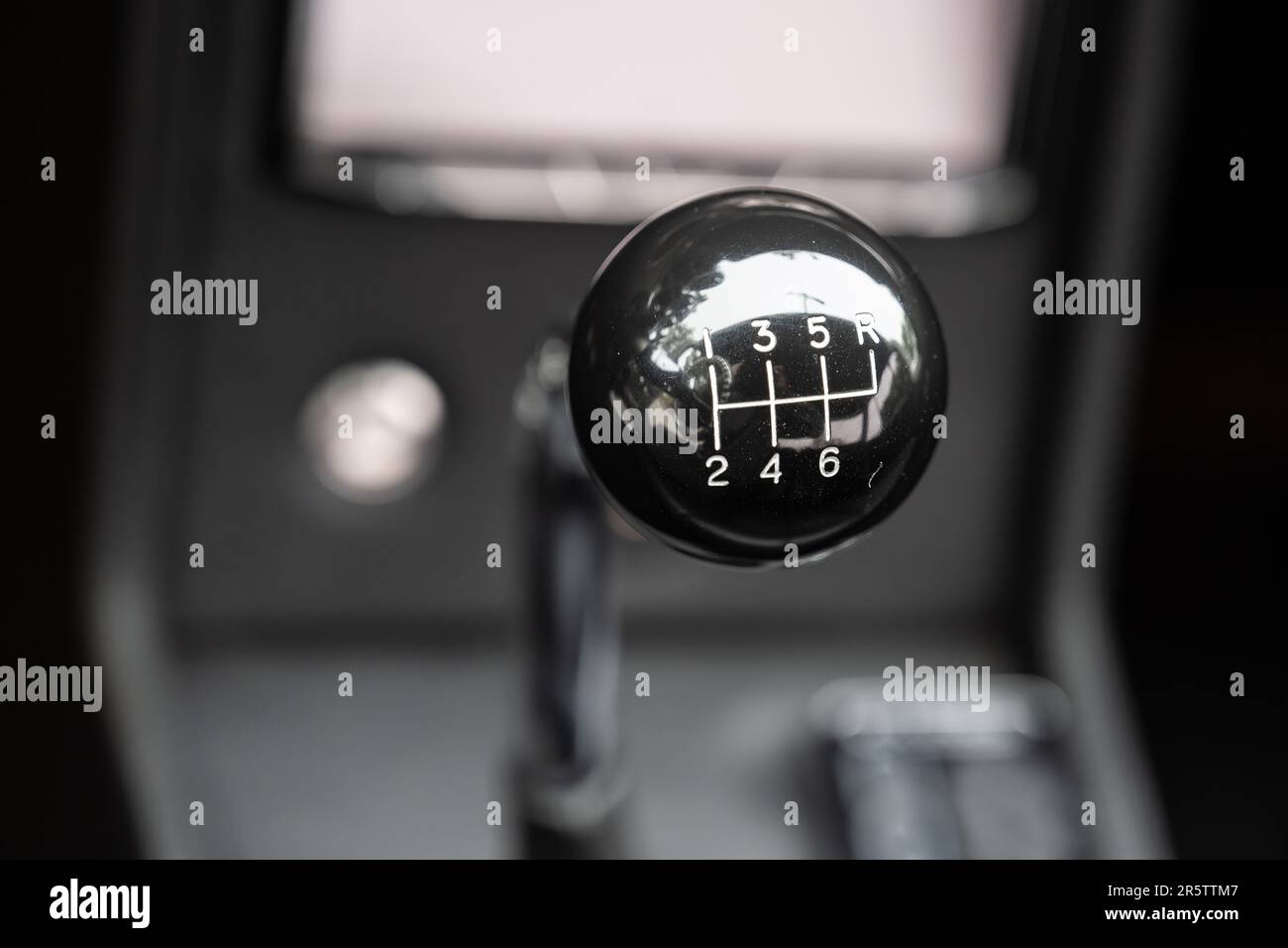 6-speed stick shifter shows all the positions for each gear of the manual transmission. Stock Photo