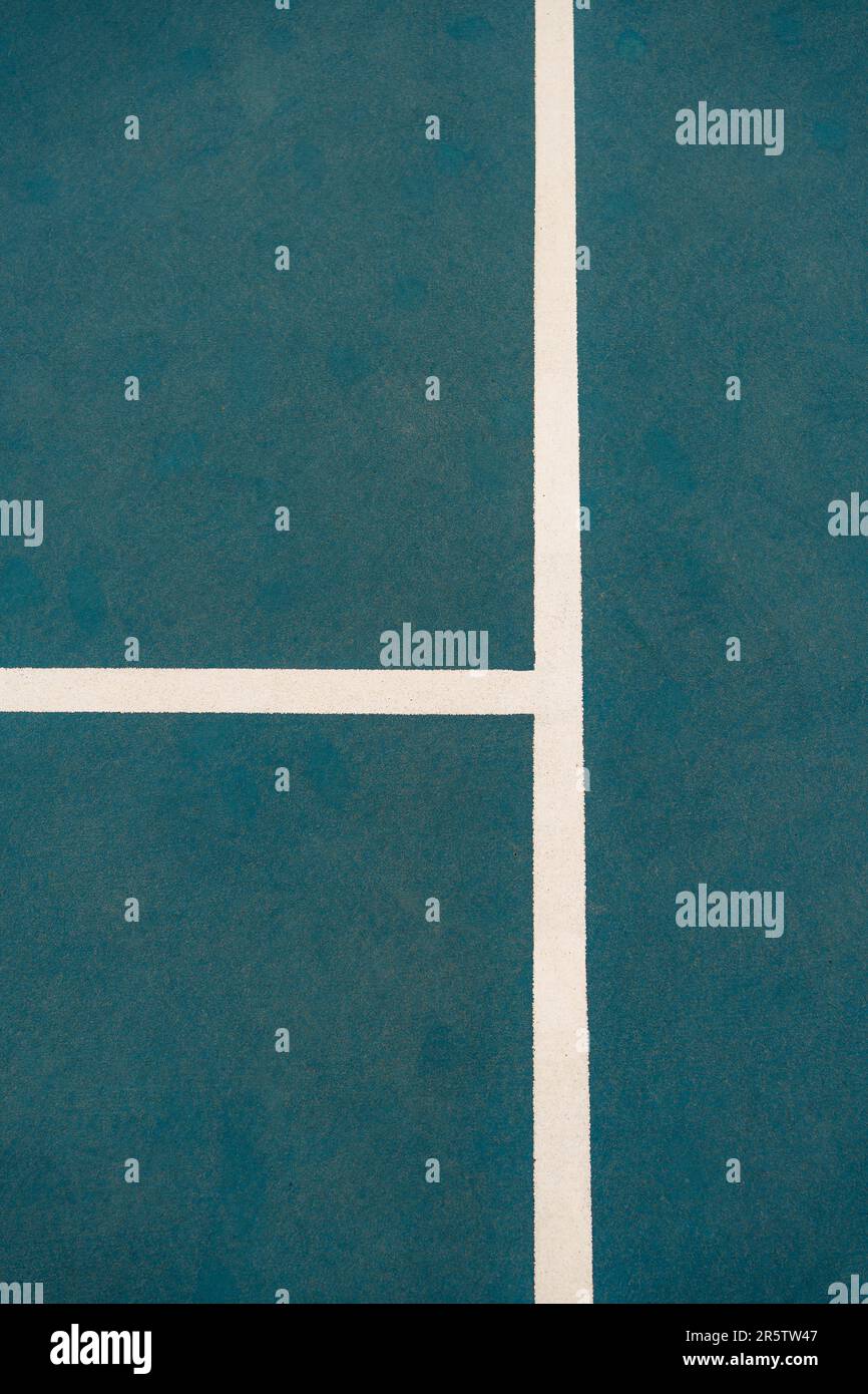 A closeup shot of a male tennis player in midswing with a tennis ball