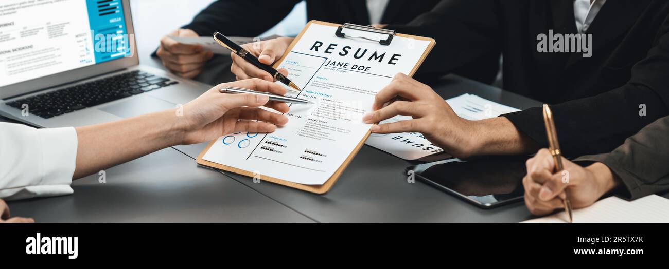 Candidate and interviewers discuss work experience and qualifications