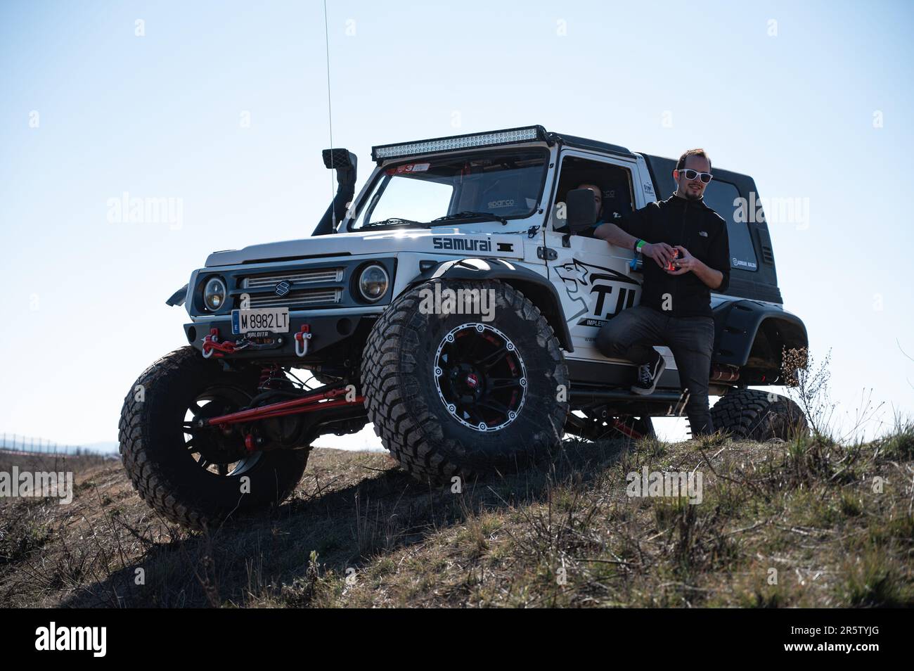 Detail of a nice white Suzuki Samurai with big wheels and snorkel modified  for crawling Stock Photo - Alamy