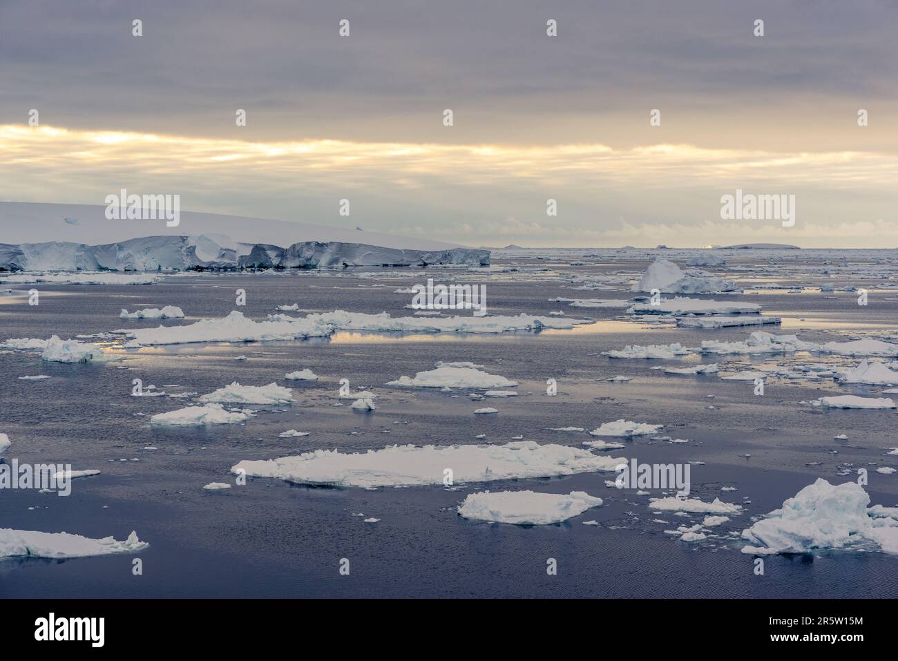 Tabular Iceberg and Midnight Sun in the Amundsen Sea, Antarctica Stock Photo