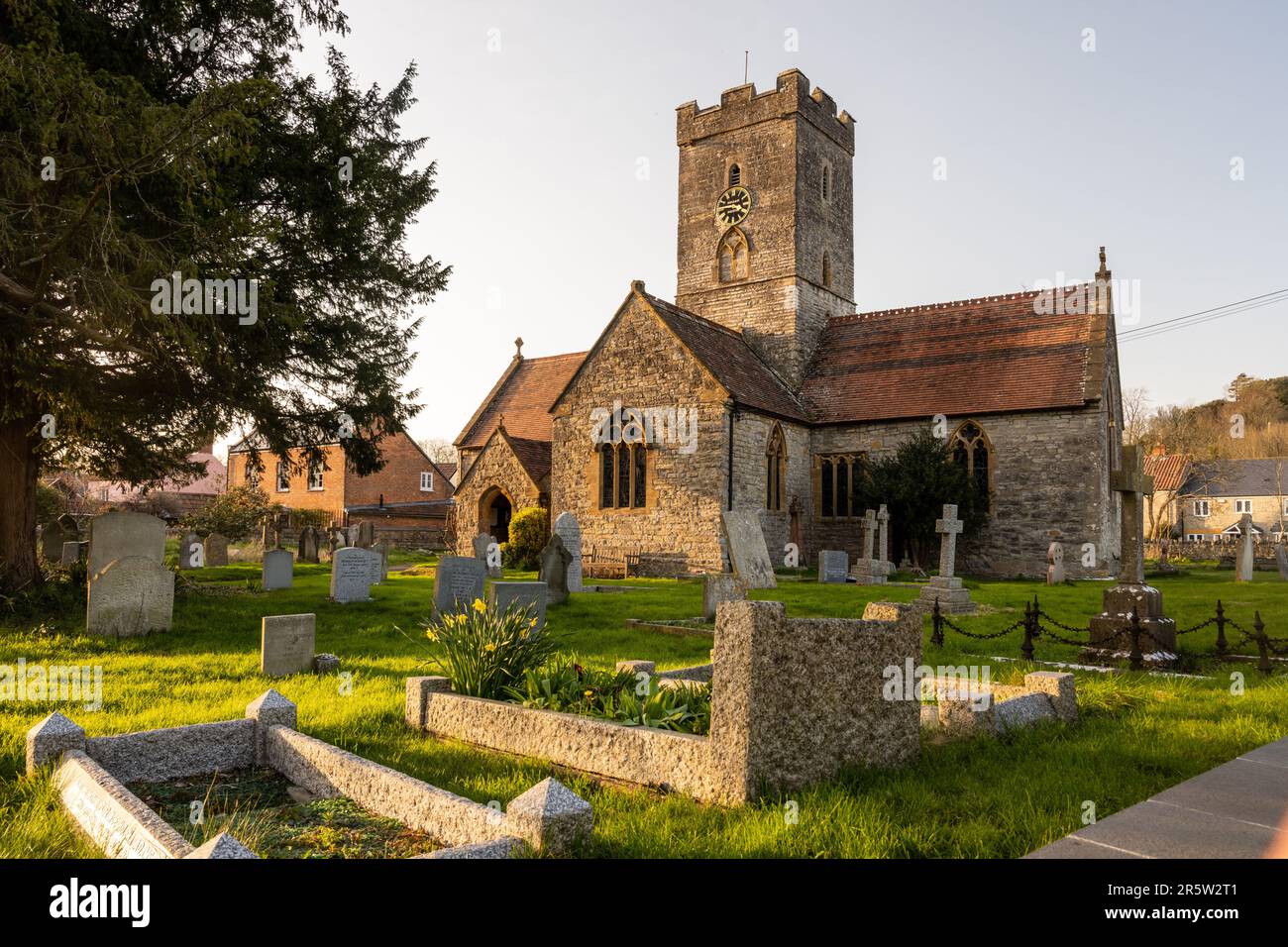 Sun shines on the traditional parish church of St Michael and All