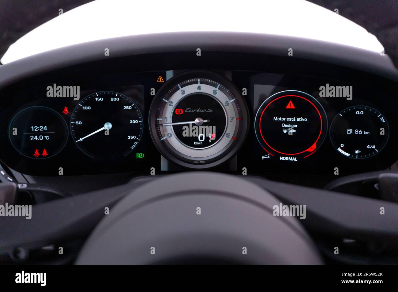 The dashboard of a motorcycle, with various gauges and odometer numbers