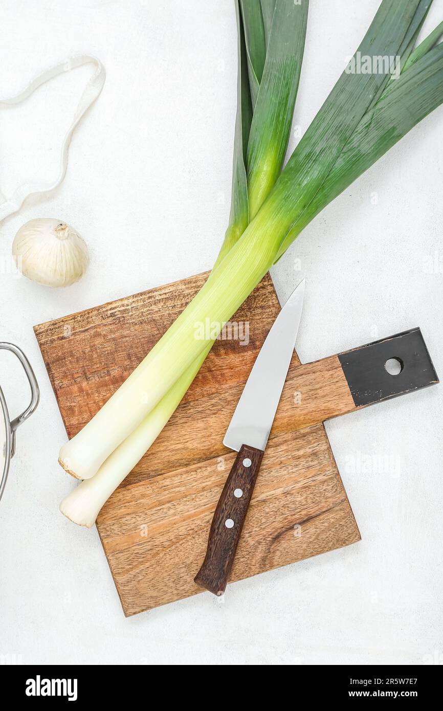 Wooden board with different kinds of onion on white background Stock ...