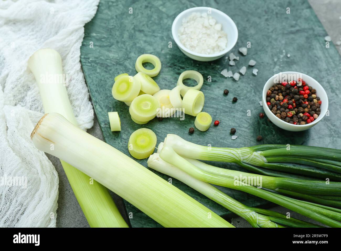 Board with different kinds of onion on grunge grey background Stock ...