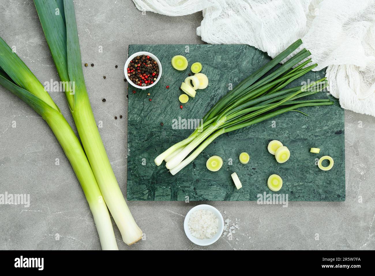 Board with different kinds of onion on grunge grey background Stock ...