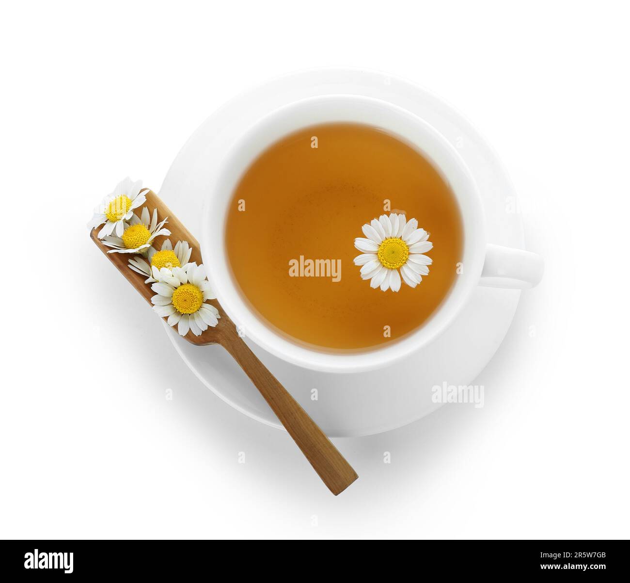 Cup of hot chamomile tea with scoop isolated on white background Stock ...
